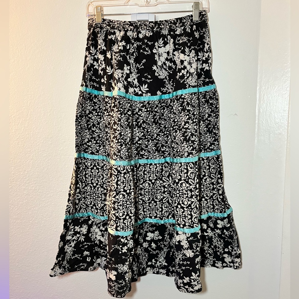 Black and white floral skirt with blue ribbon trim